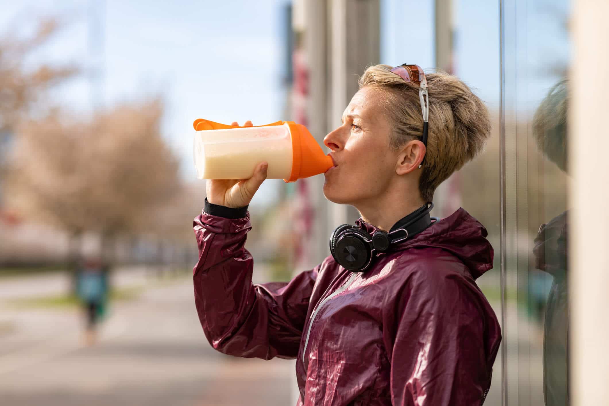 Woman drinking milk on a run
