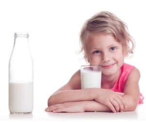Little girl with a bottle of milk