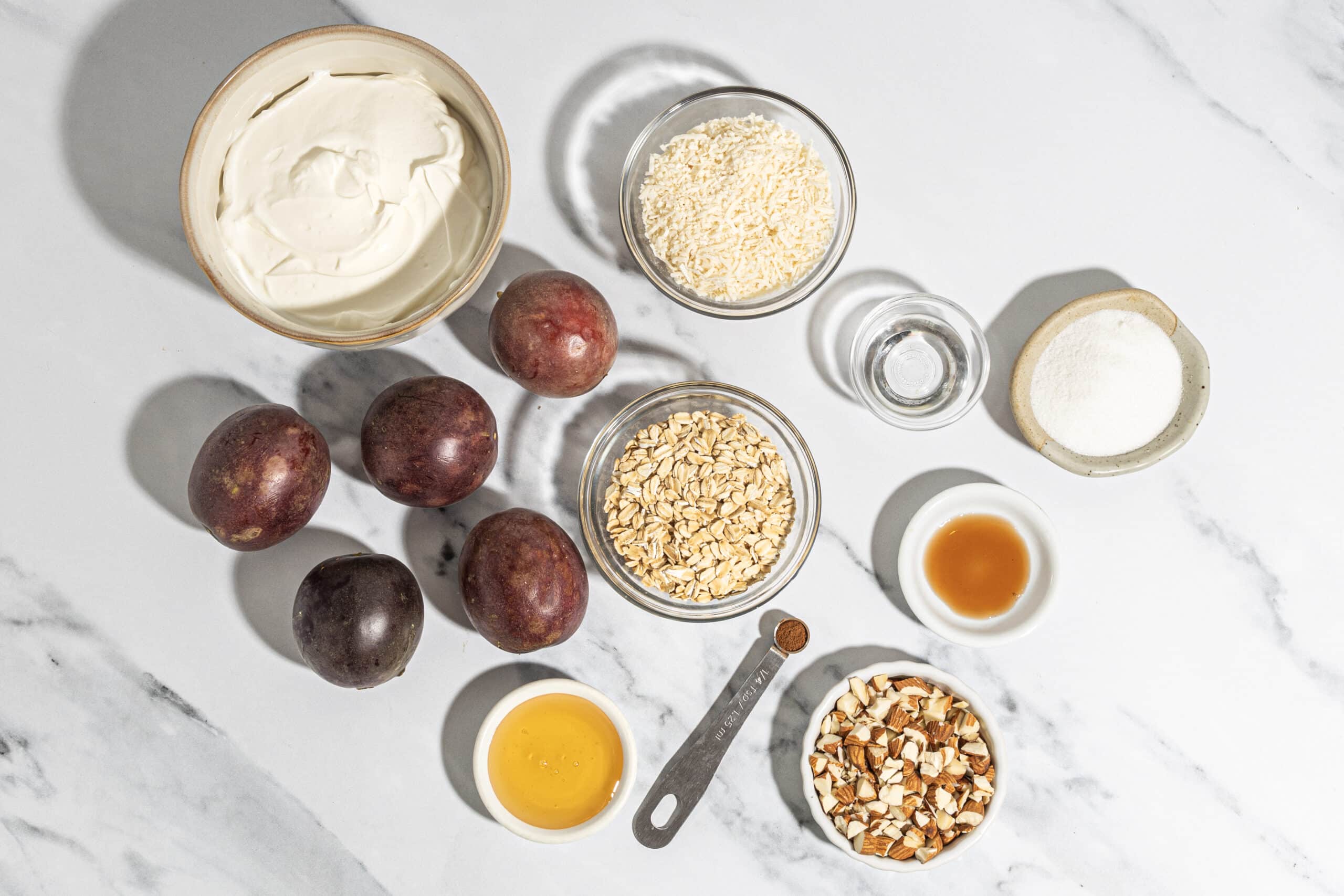 A group on ingredients, some served in bowls and some loose on a table.